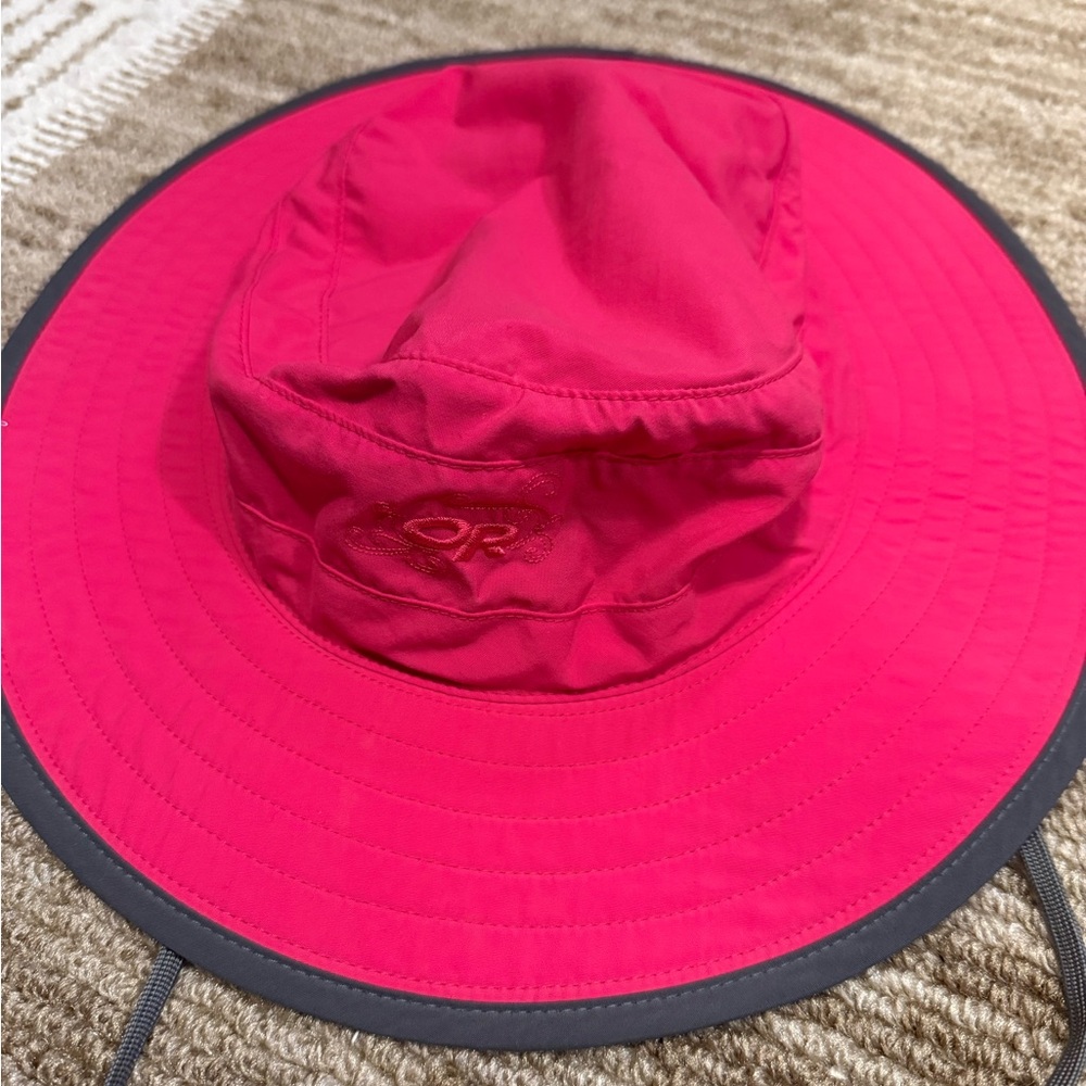 Pink with grey trim Outdoor Research Adjustable Sun Hat.
